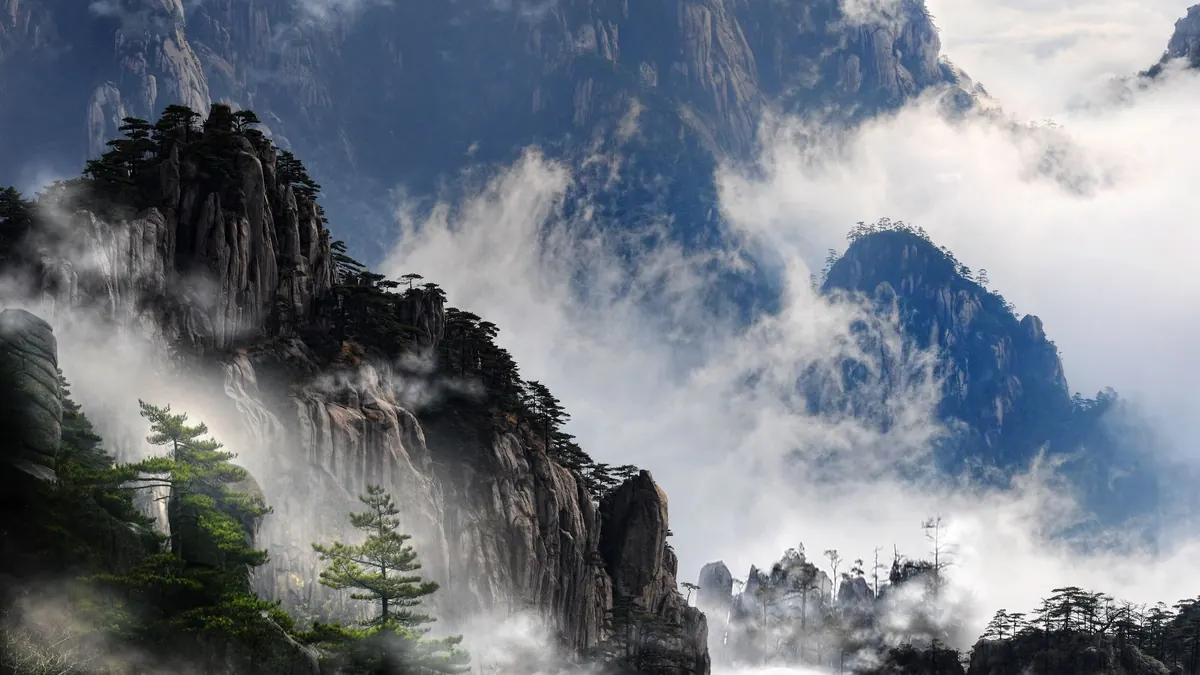 Misty granite peaks and pines above a sea of clouds on Huangshan