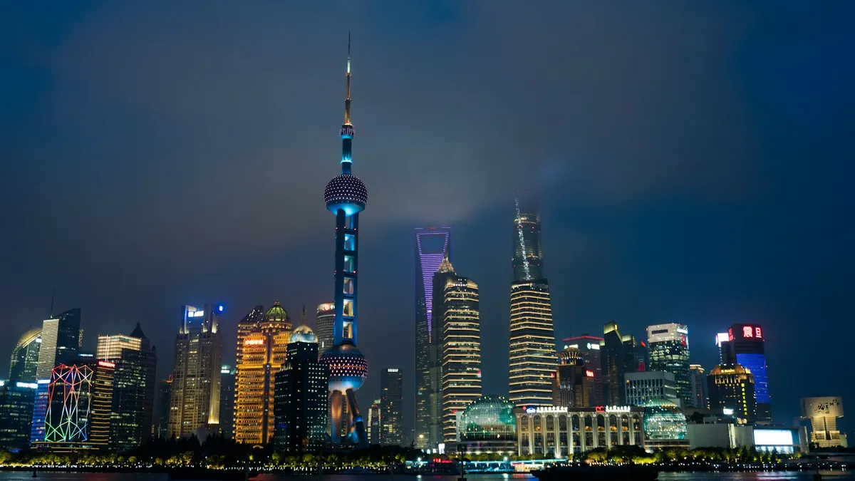 The Bund at night, with the Oriental Pearl Tower across the Huangpu in Shanghai
